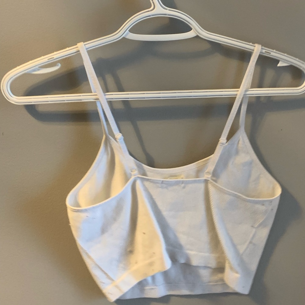 White ribbed thin strap tank top.